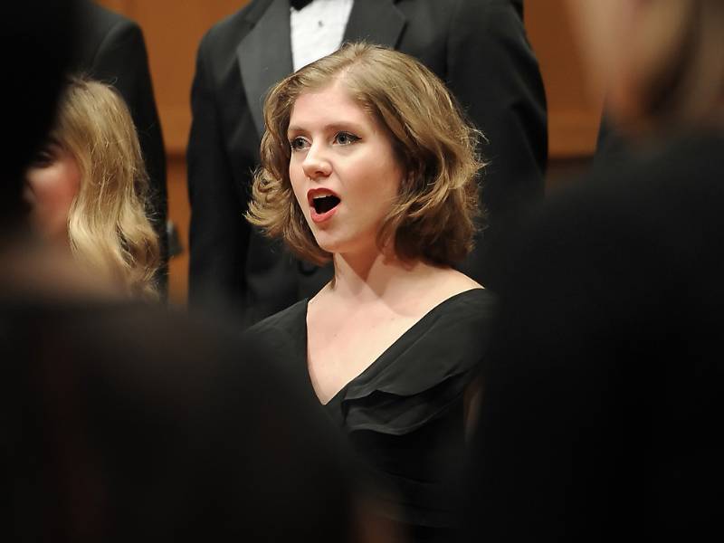 This is an image of a concert choir member who is singing
