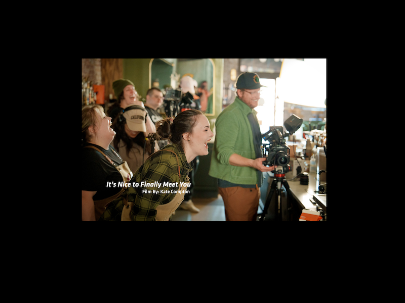 actors in a coffee shop with camera crew