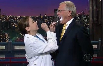 Photo of Jane Gabbert playing a medical official examining David Letterman. 