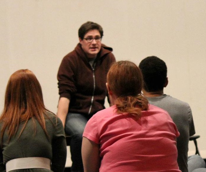 Rich Sommer teaching a number of students. 
