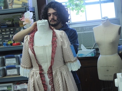 design student working on a costume