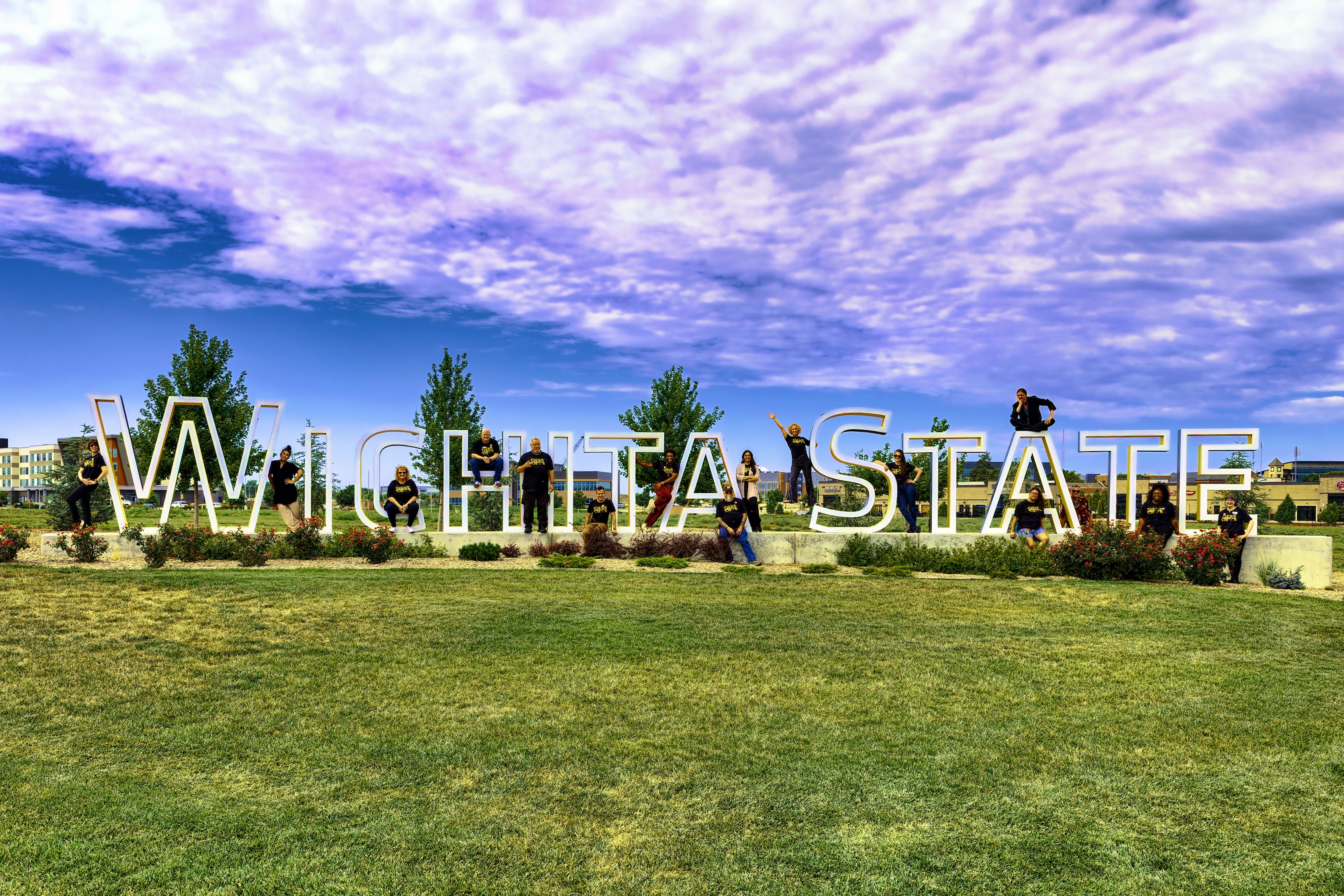 SPA Faculty & Staff with the WSU sign