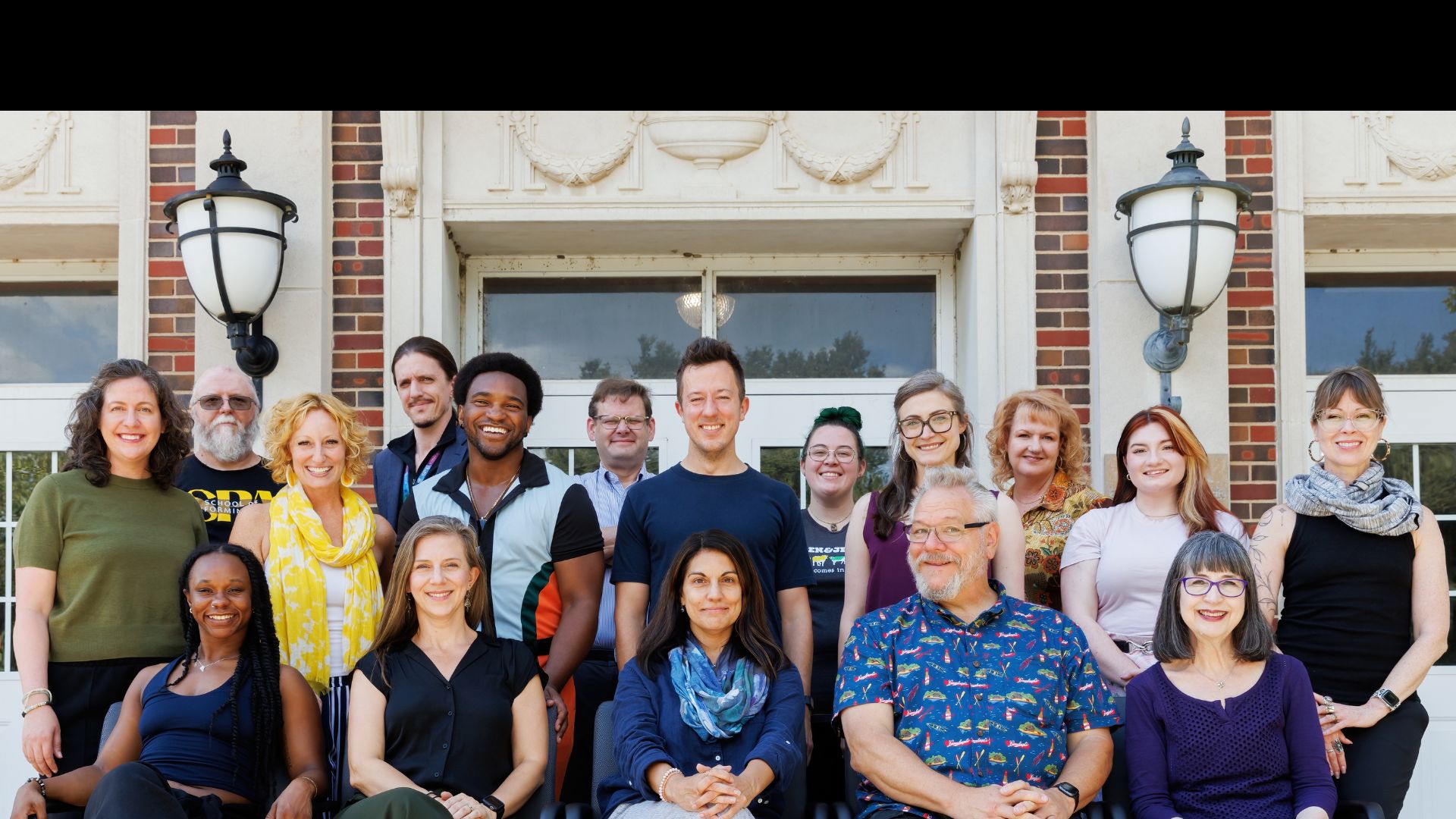 SPA Faculty & Staff with the WSU sign