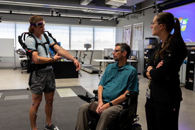 Graduate Faculty with student in a lab
