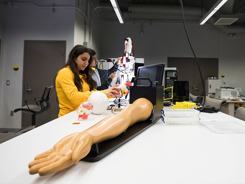 Students working in a lab on wearable medical devices