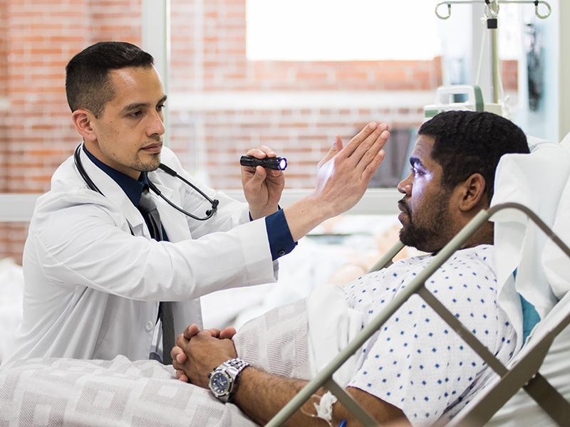 PA examines a patient