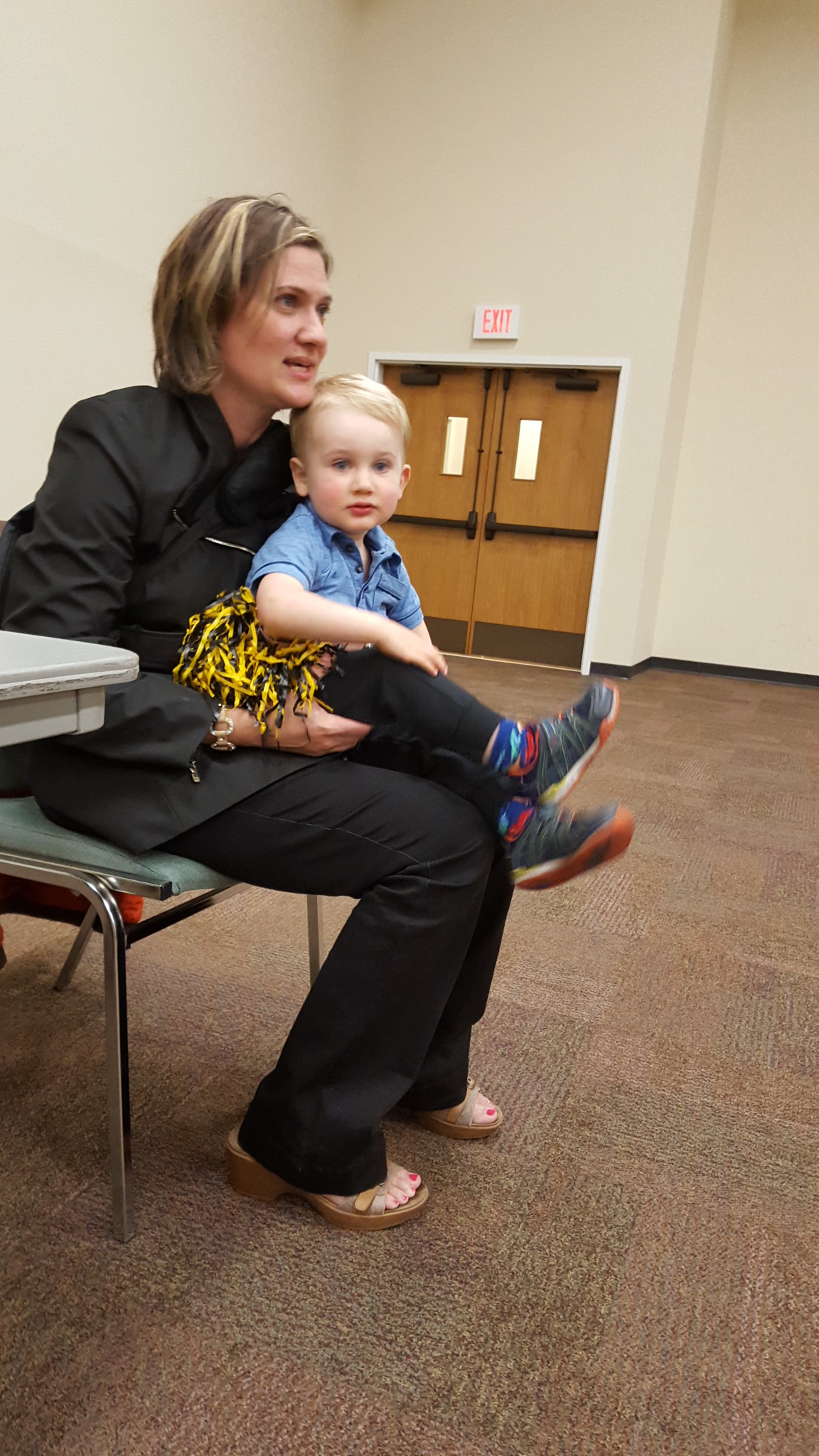 Retirement reception attendee with baby. 