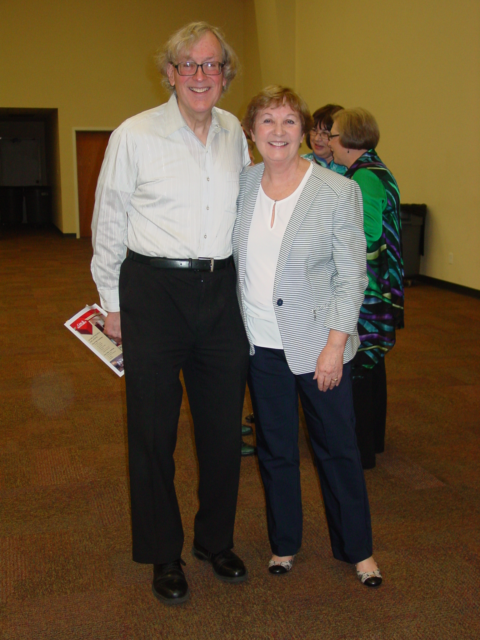 Kathy Strattman posing with a guest at her retirement reception. 