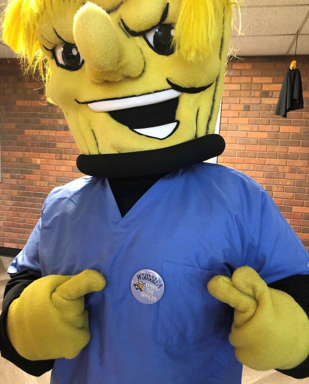 Wu wearing WSUSSLHA button