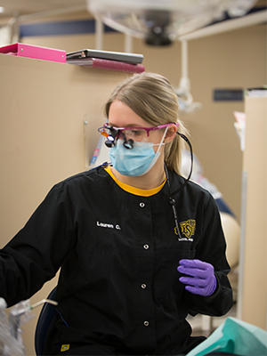 Dental Hygiene student working in the DH Clinic
