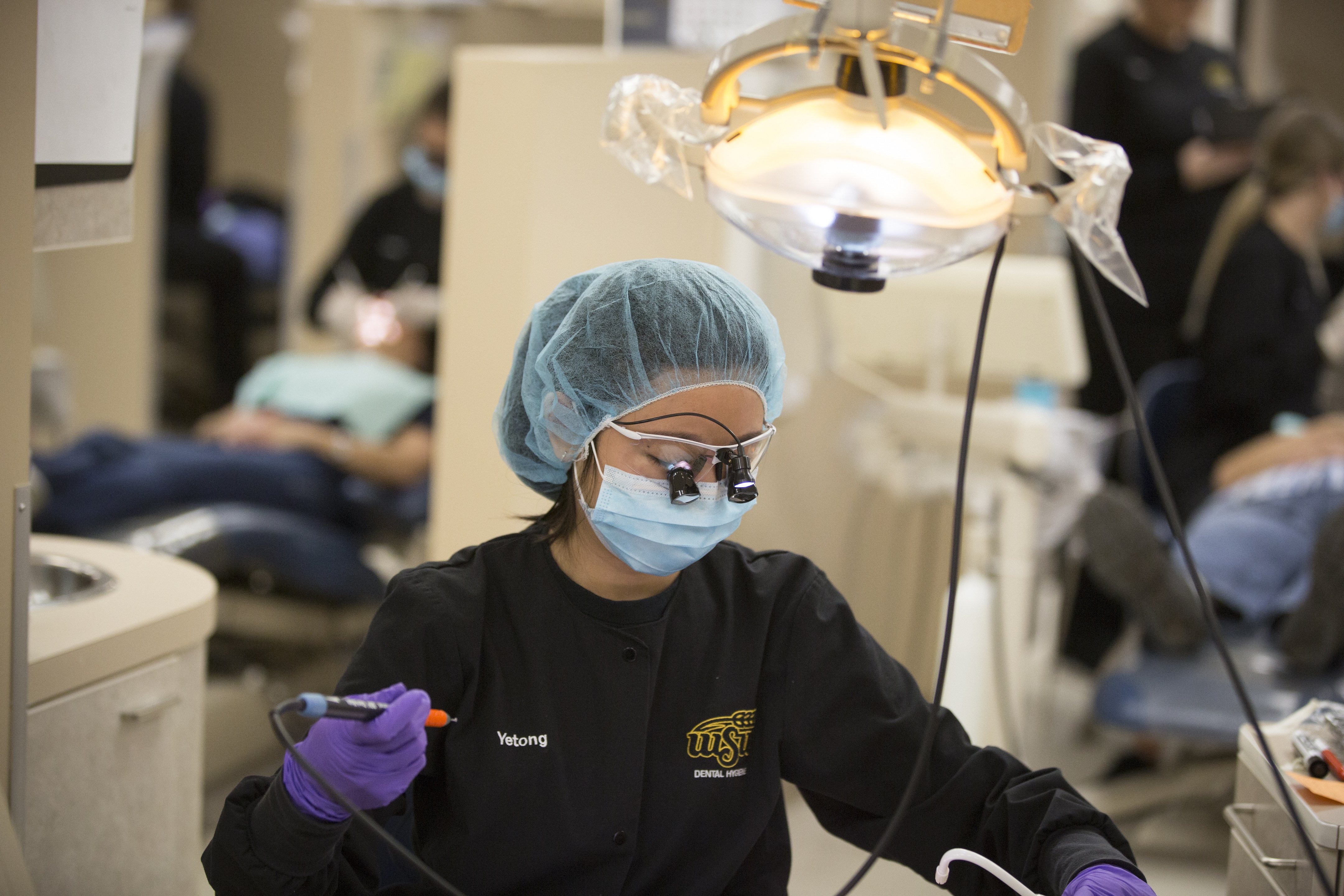 dental-hygiene-student-working-on-patient