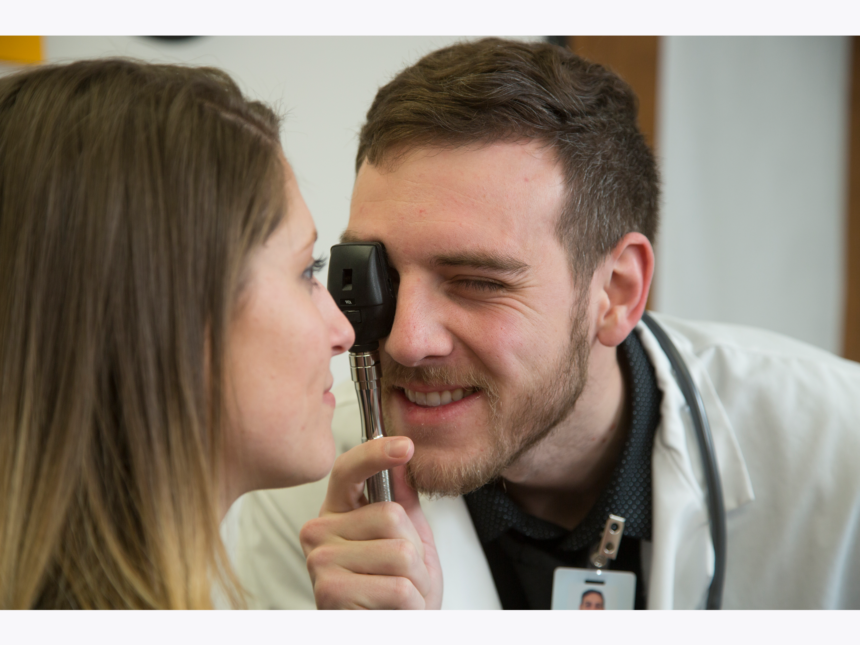 DNP student practicing eye exam on patient