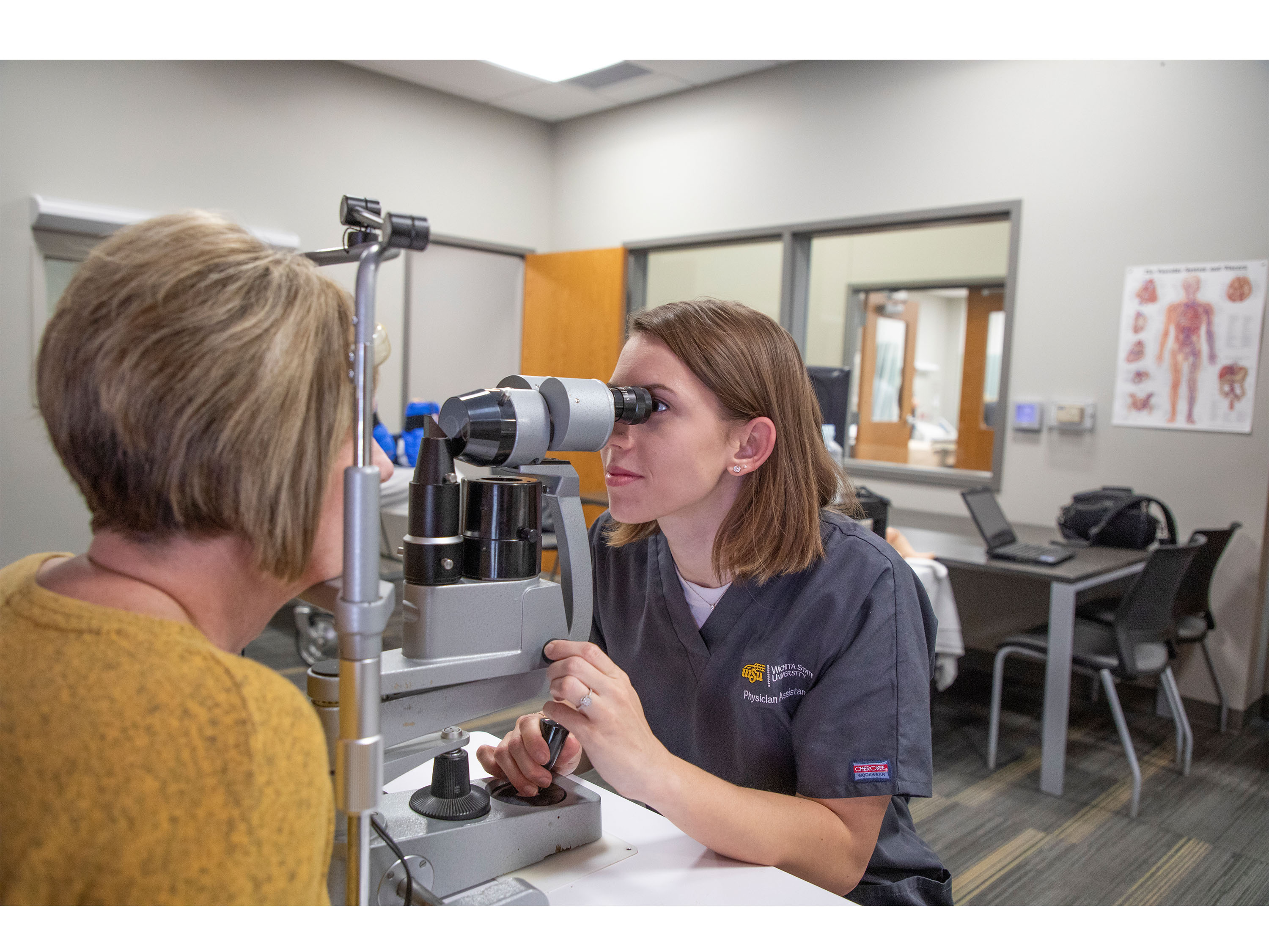 Physician Assistant examines patient