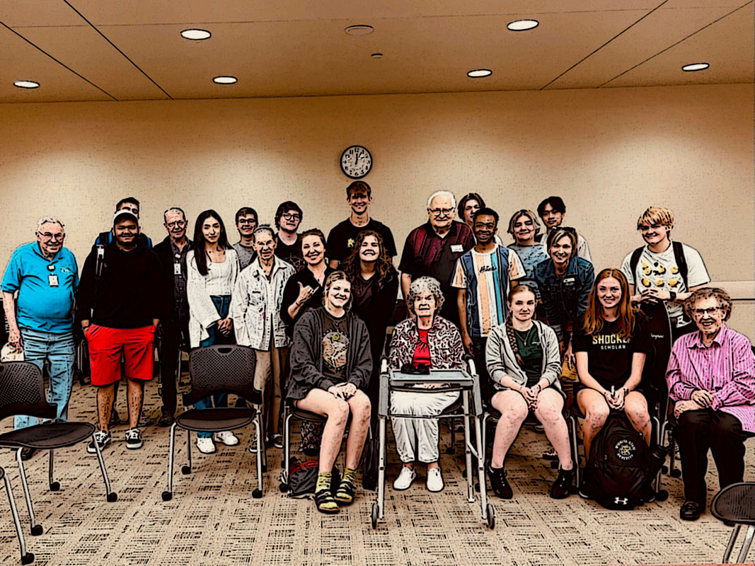 Larksfield Senior Living Community with students in group photo.