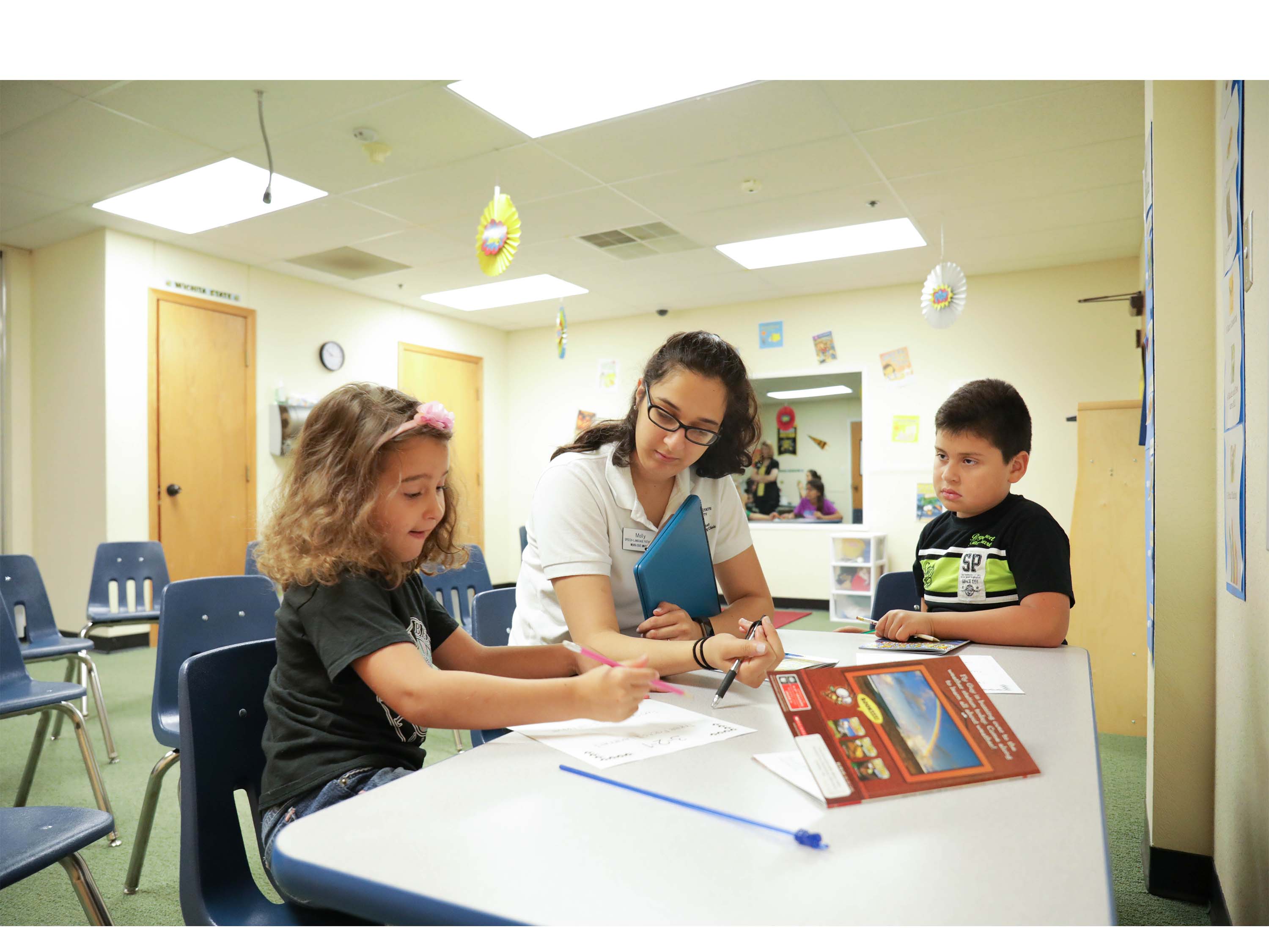 Speech-Language Pathology student working with children at Literacy Camp