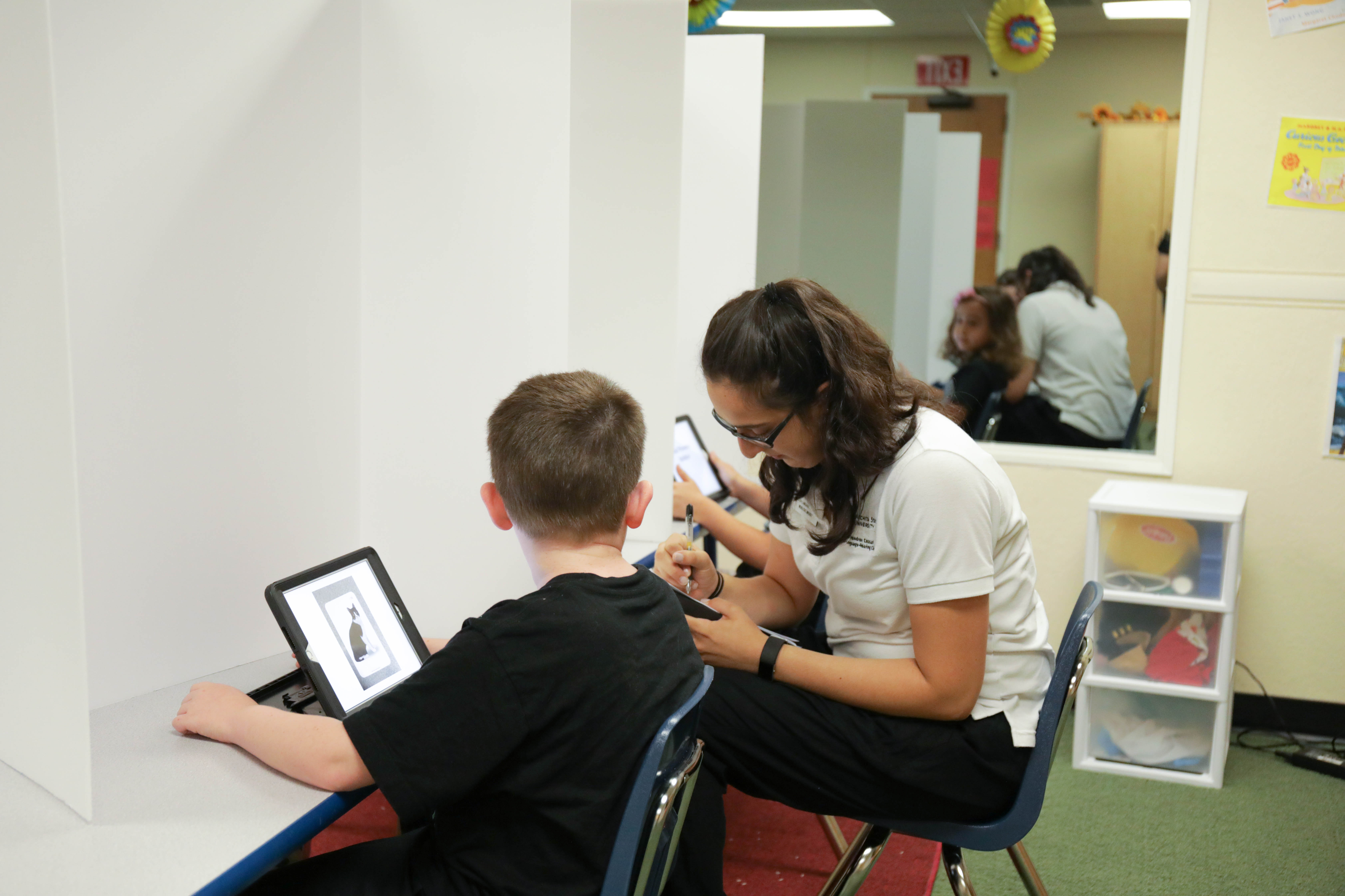 student working with child during Literacy Camp