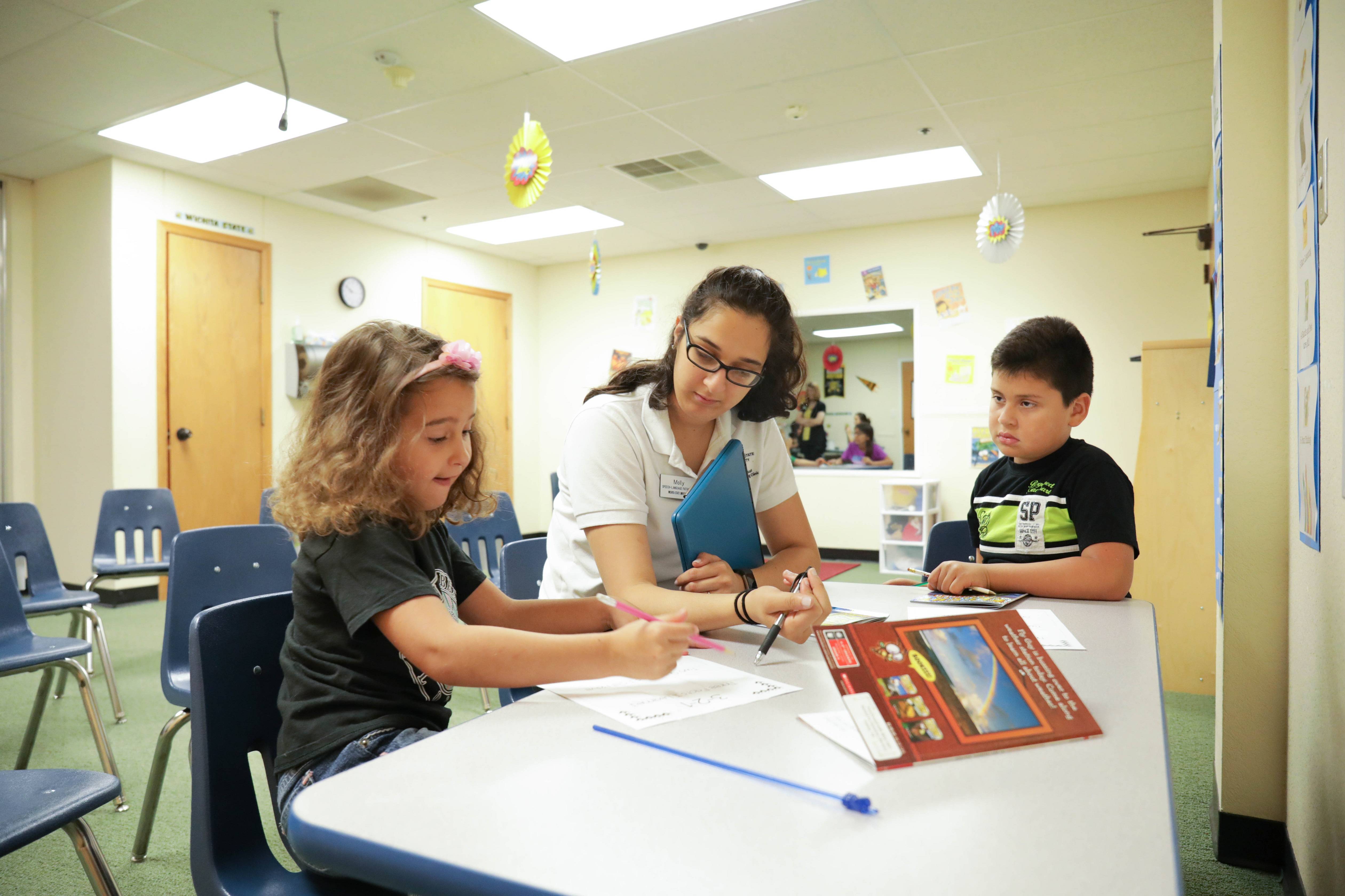 student working with children