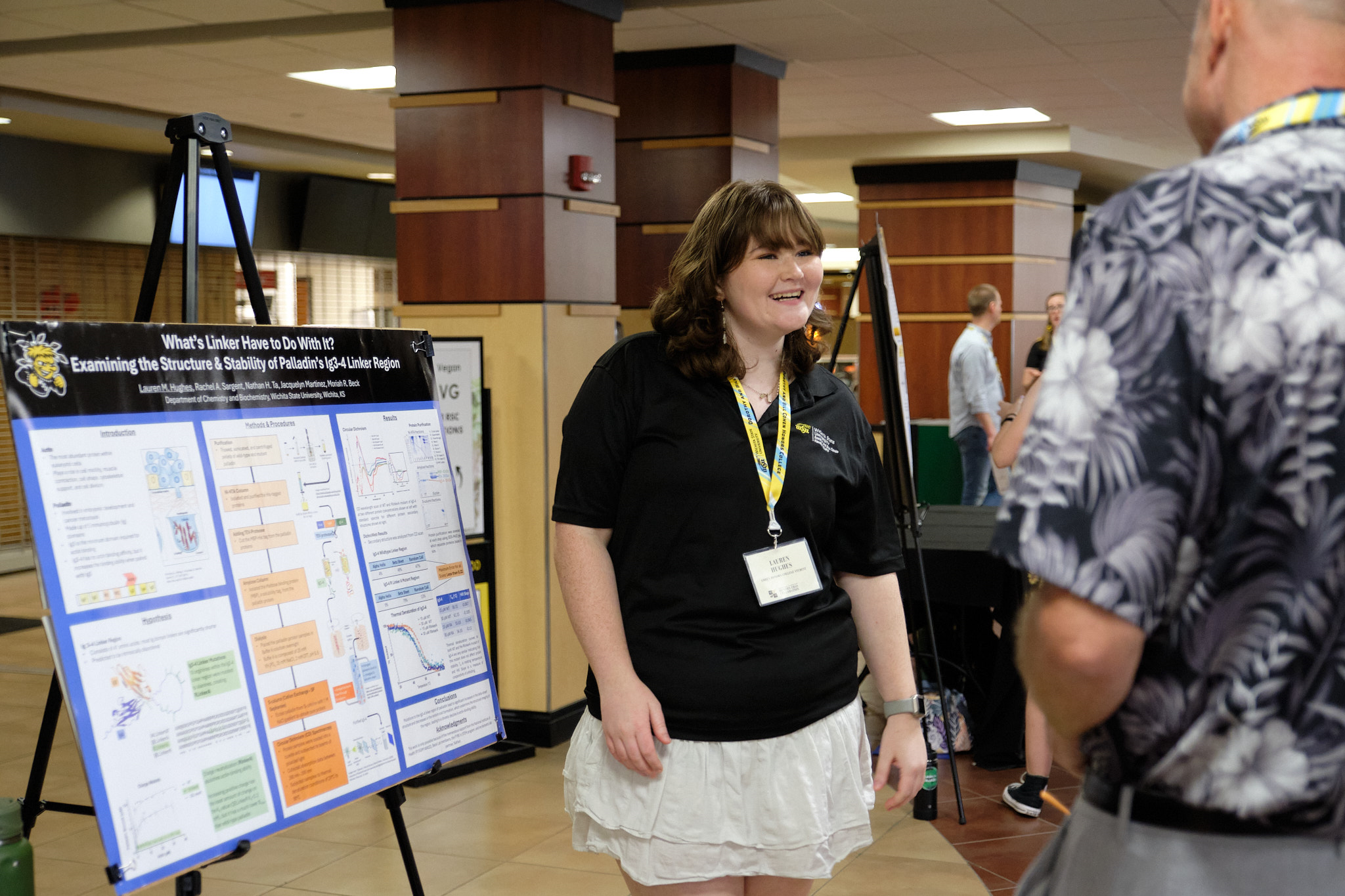 Student presenting her research during the student showcase portion of the event.