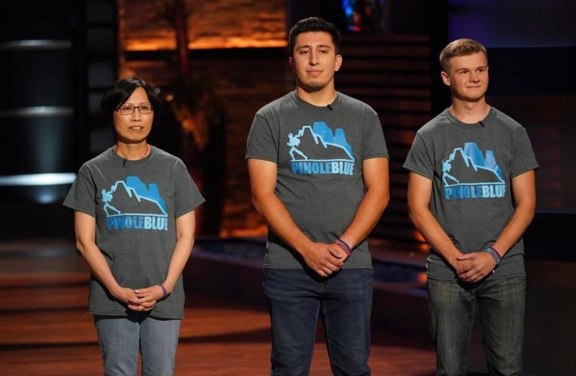 A photograph of Honors alum Eddie Sandoval with his business partner Kyle Offutt and Wichita State University business professor and advisor Kate Kung-McIntyre.