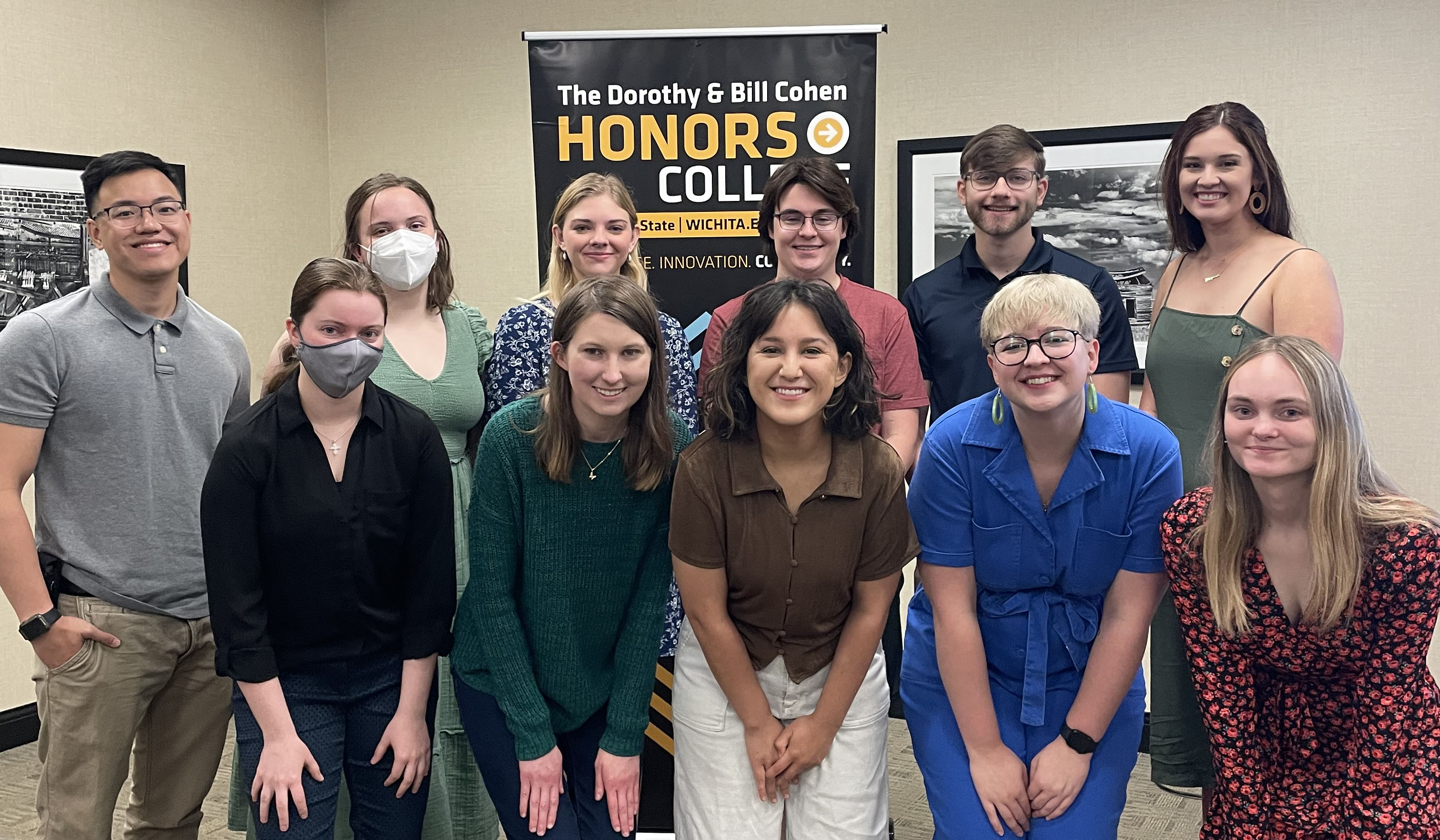 A group of 11 graduating Honors students posing for a photo at the Donuts, Coffee, and Kudos Celebration event. Pictured left to right are: Ngoc Vuong, Analisa Bridge, Jadie Chauncey, Madeline Smith, Ella Ihrig, Savannah Redfern, Matthew Anderson, Savannah Gann, Franklin Hurst, Ava Munzinger-DeFrain, and Sydney Wyatt.