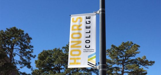 Honors College banner on a pole