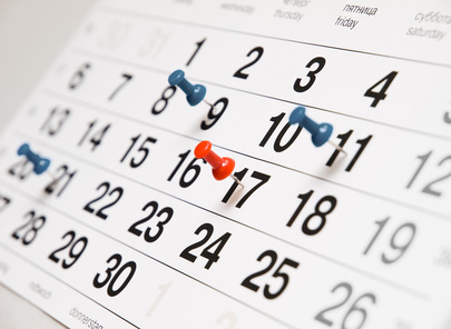 Picture of a calendar page with push pins