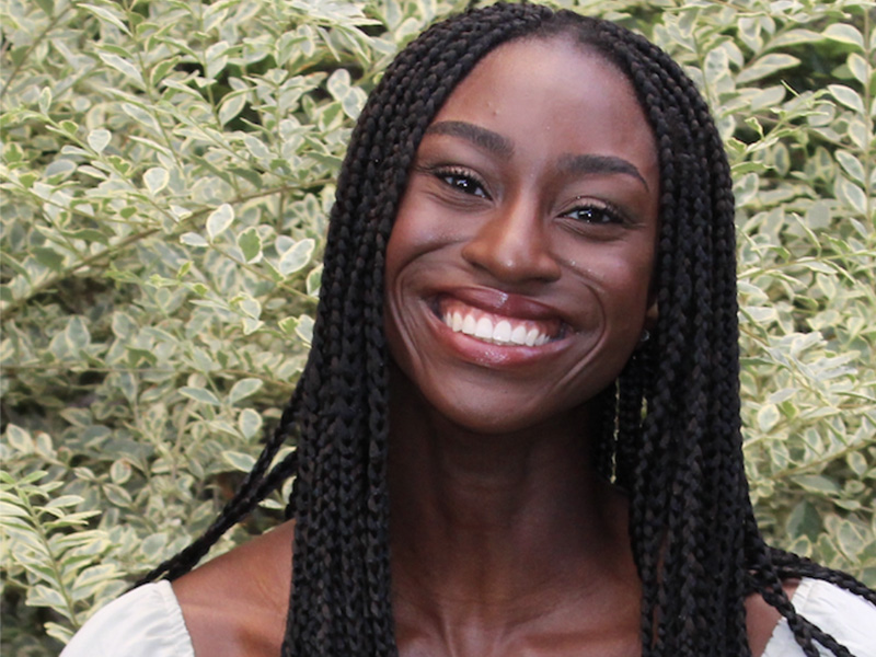 Chinelo Ogogor against a leafy background