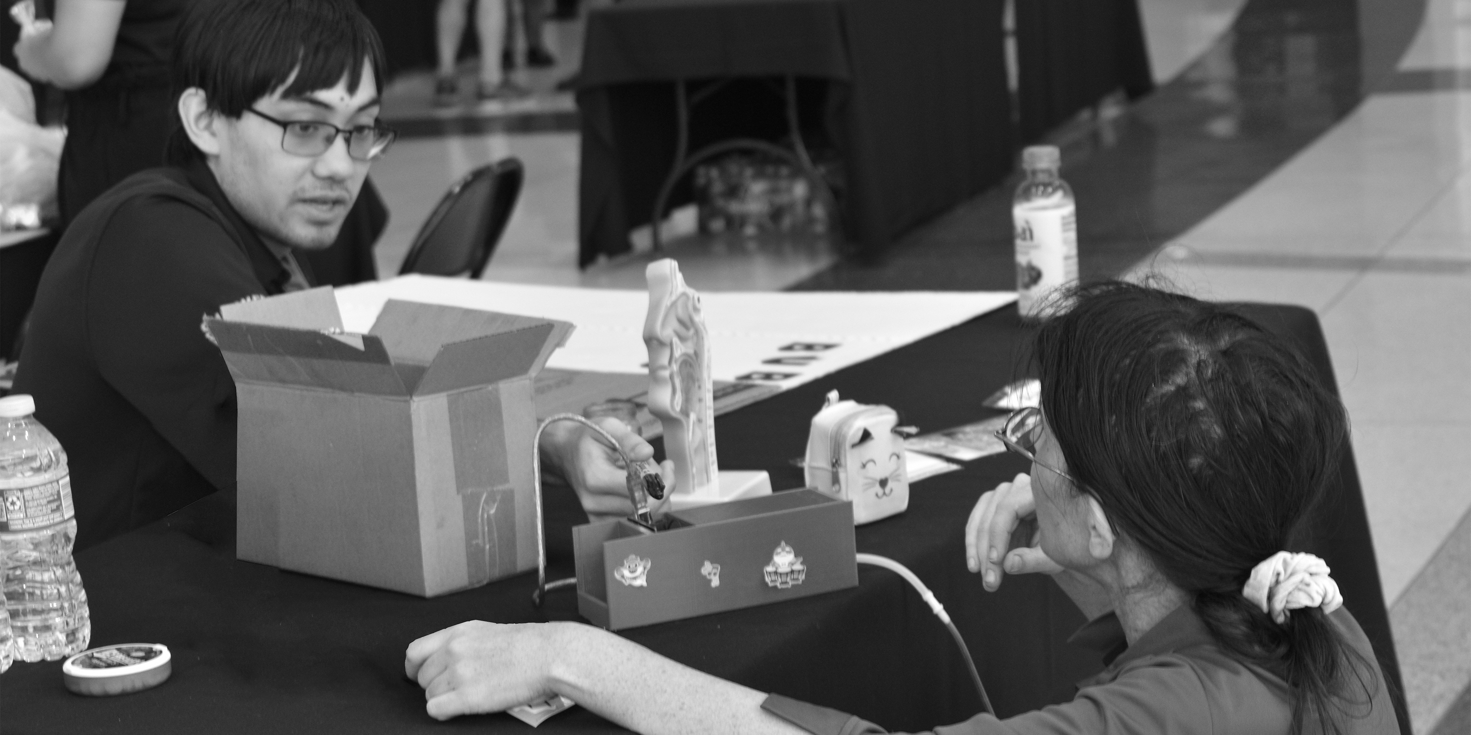 Entrepreneurs putting together a display before pitching
