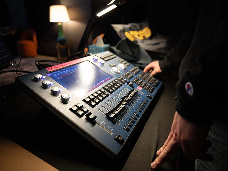 Close-up of a student at an audio mixer.