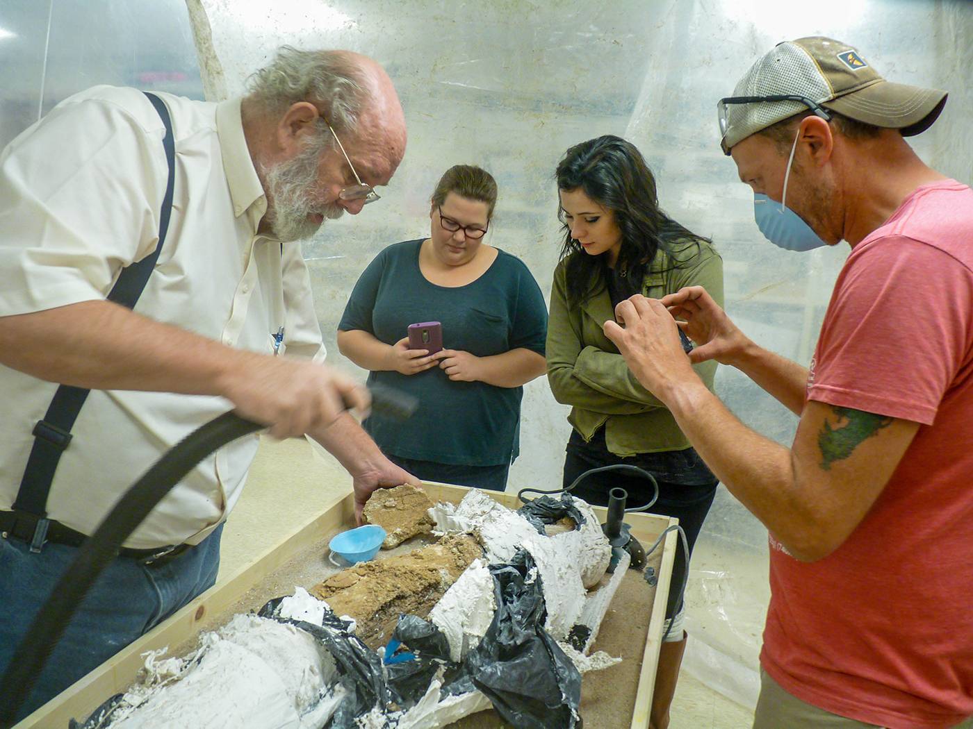 An anthropology professor with his students. 