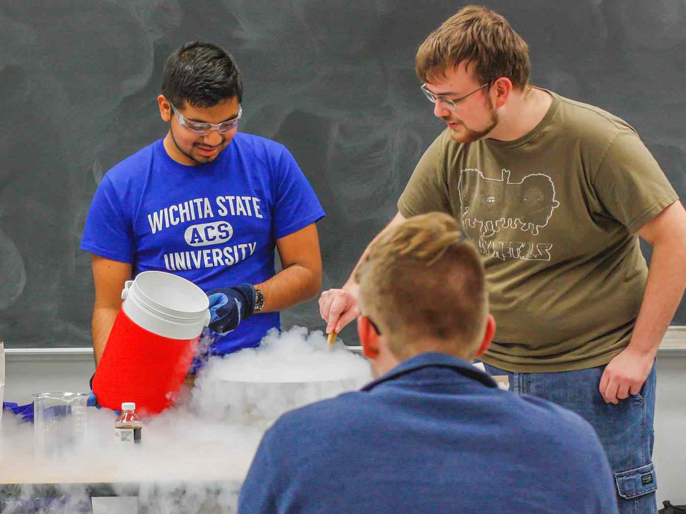 Students performing an experiment.