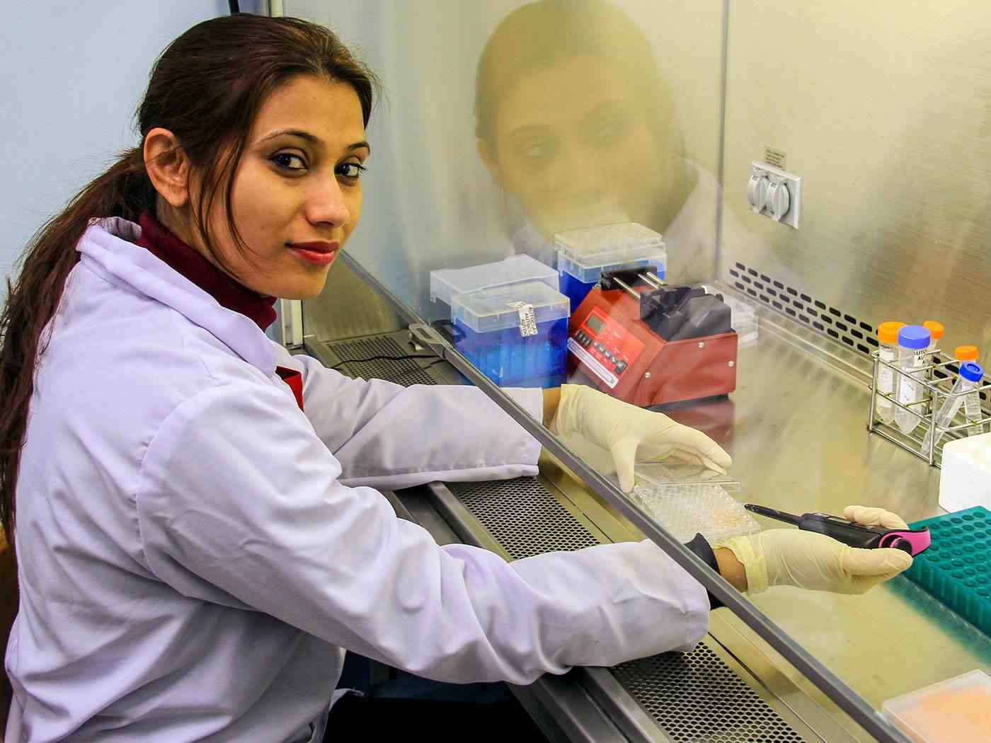 Student measuring in the lab.