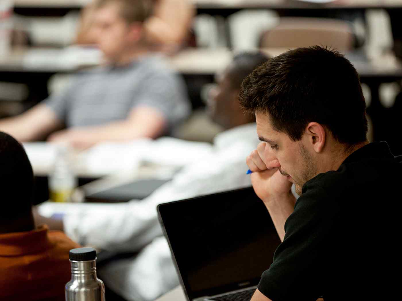 Student listening to a lecture in the classroom.