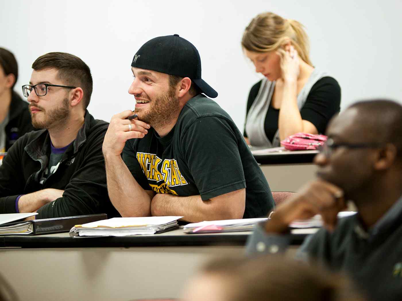 MBA graduate student listening to a lecture.