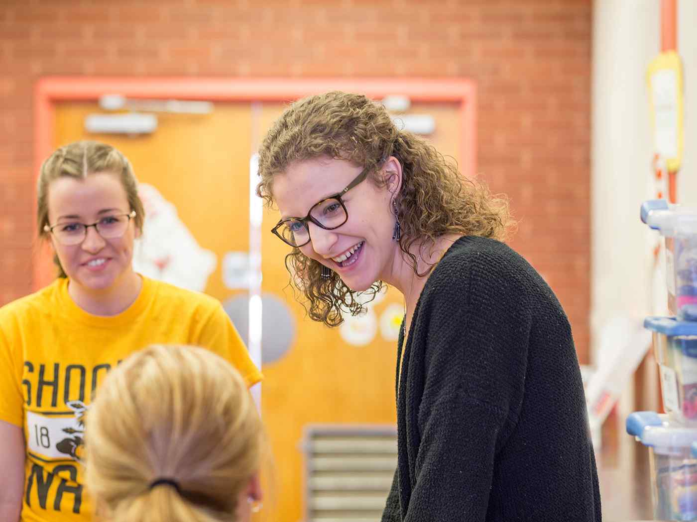 Female students talking to their professor.
