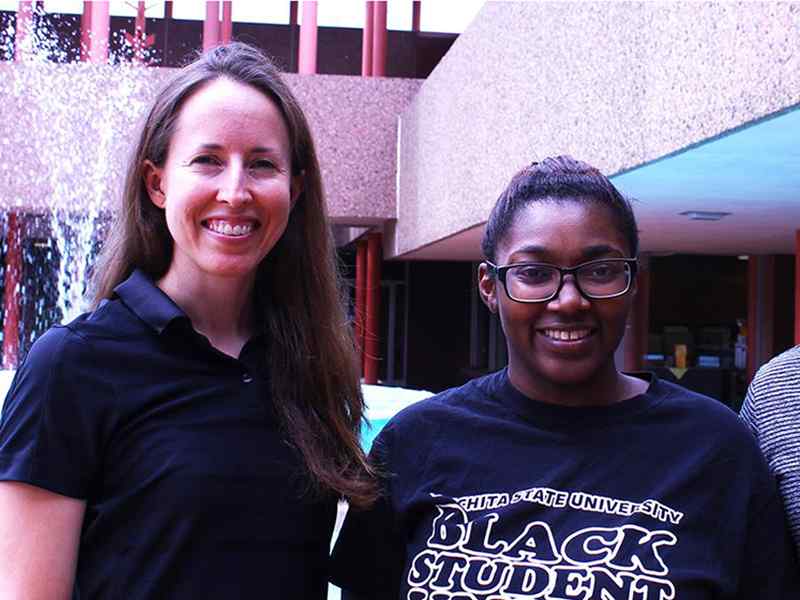 Jazmin Dennis, center, has a passion for teaching.