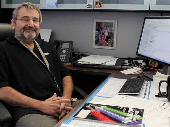 WSU engineer Billy Martin seated at his desk