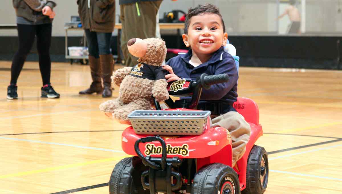 Students help modify cars for children with disabilities.