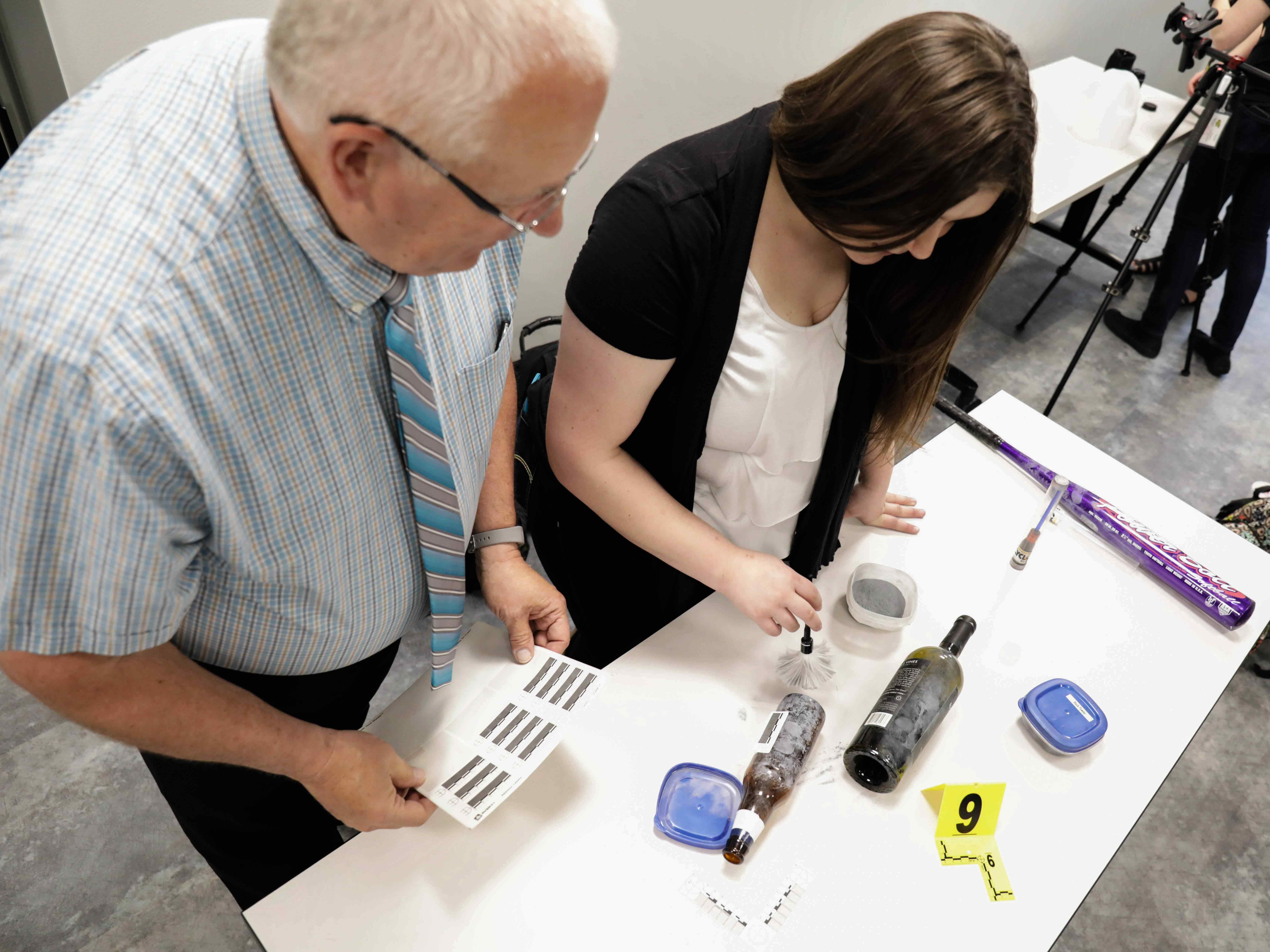 Student and her professor studying evidence.