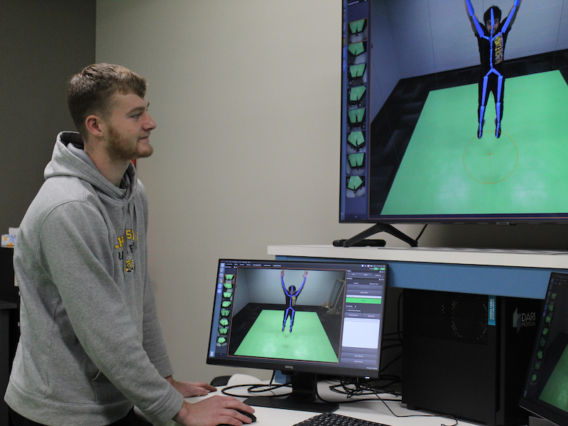 A student working in the WSU Human Performance Laboratory, operating the DARI Motion capture system.