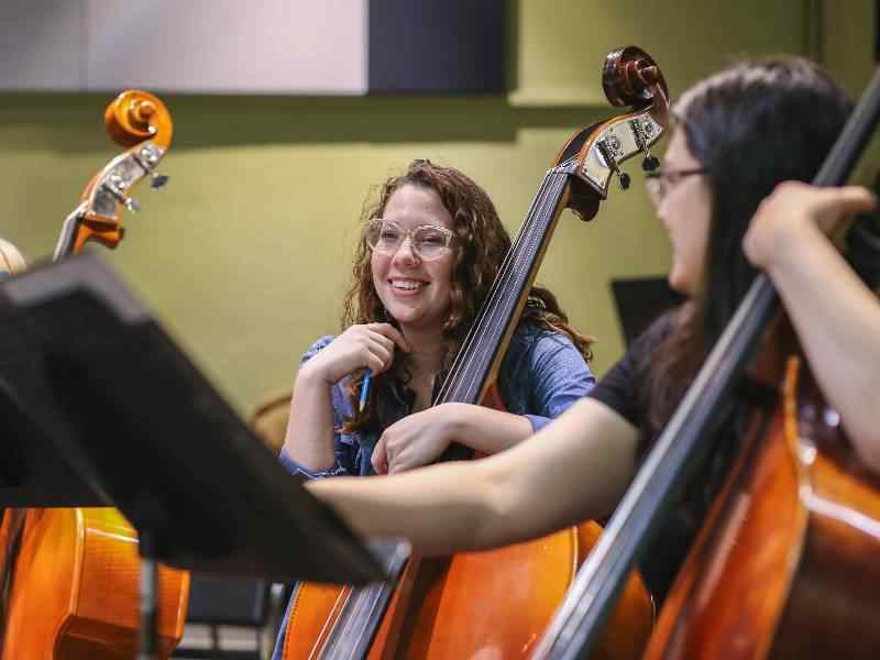 Female student with bass.