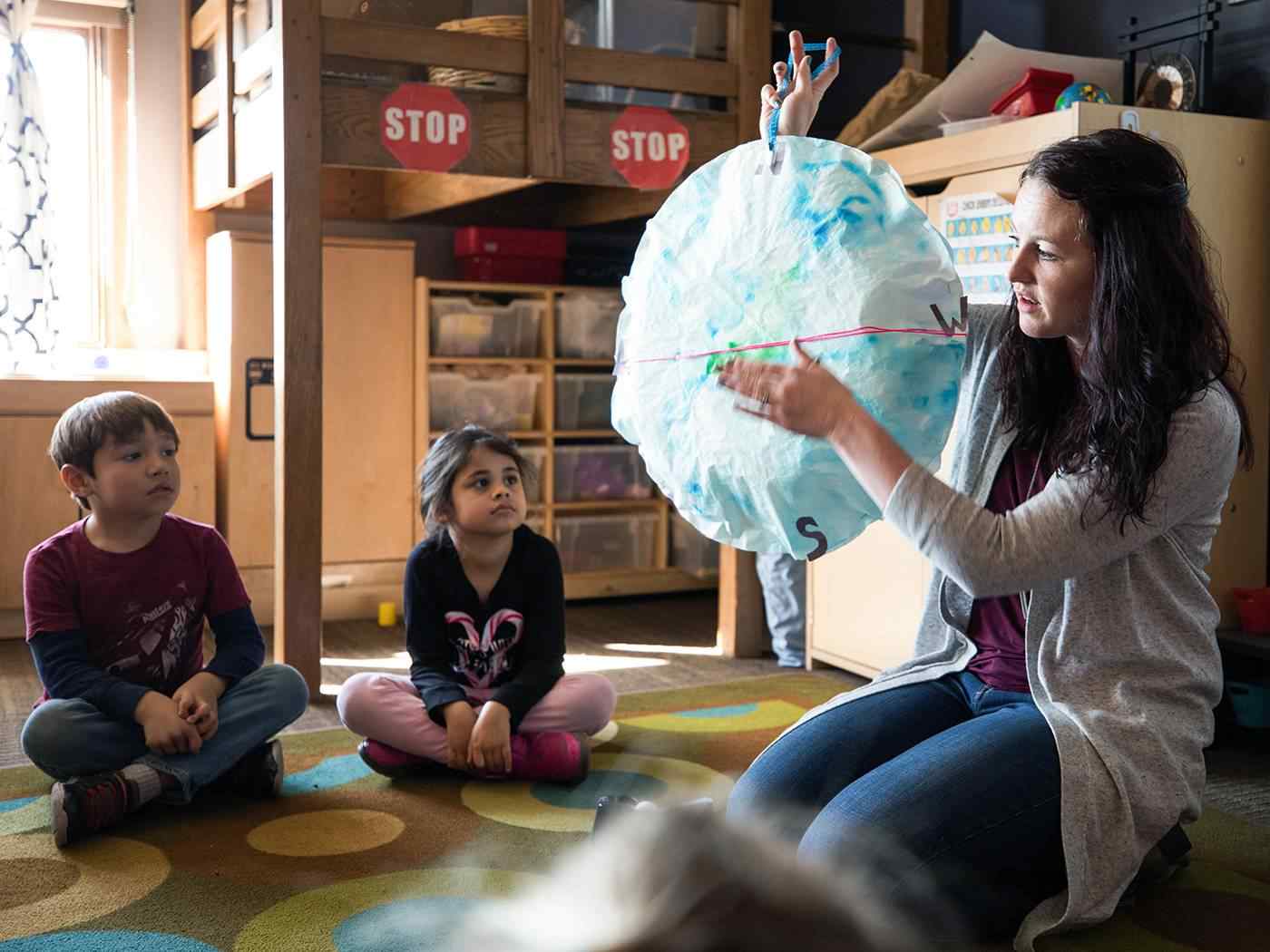 Female student teacher in classroom.