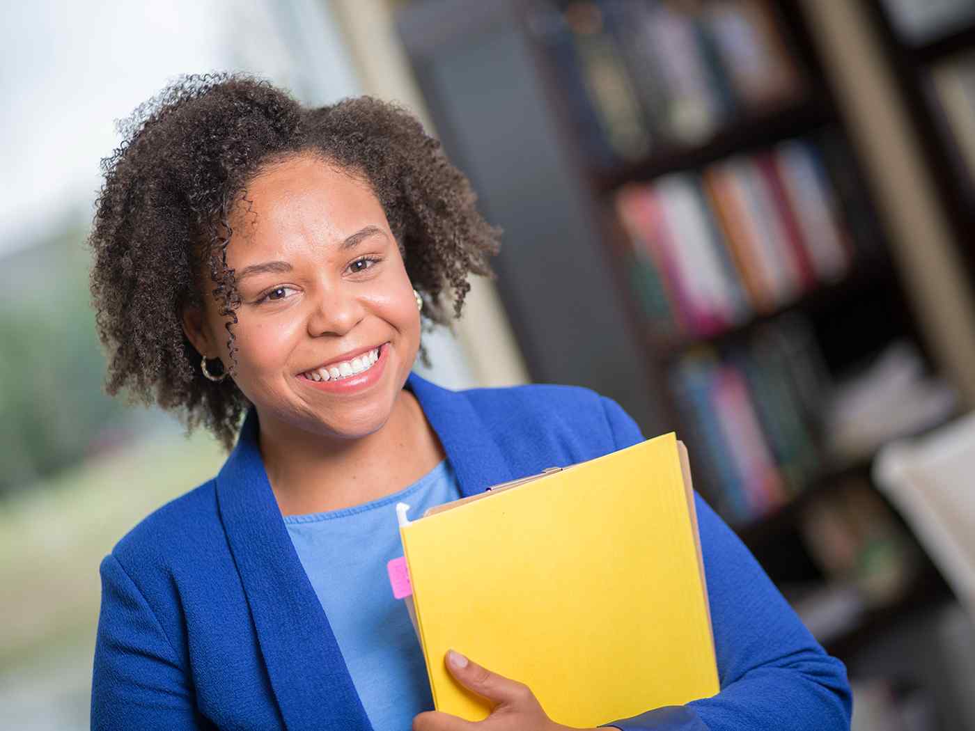 Female student holding files