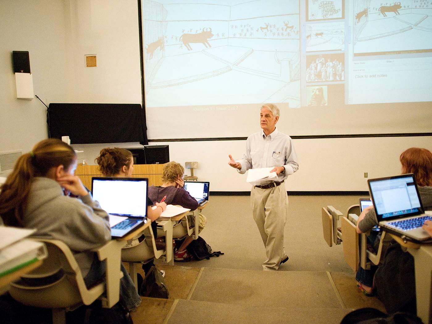 Art teacher instructing a class. 