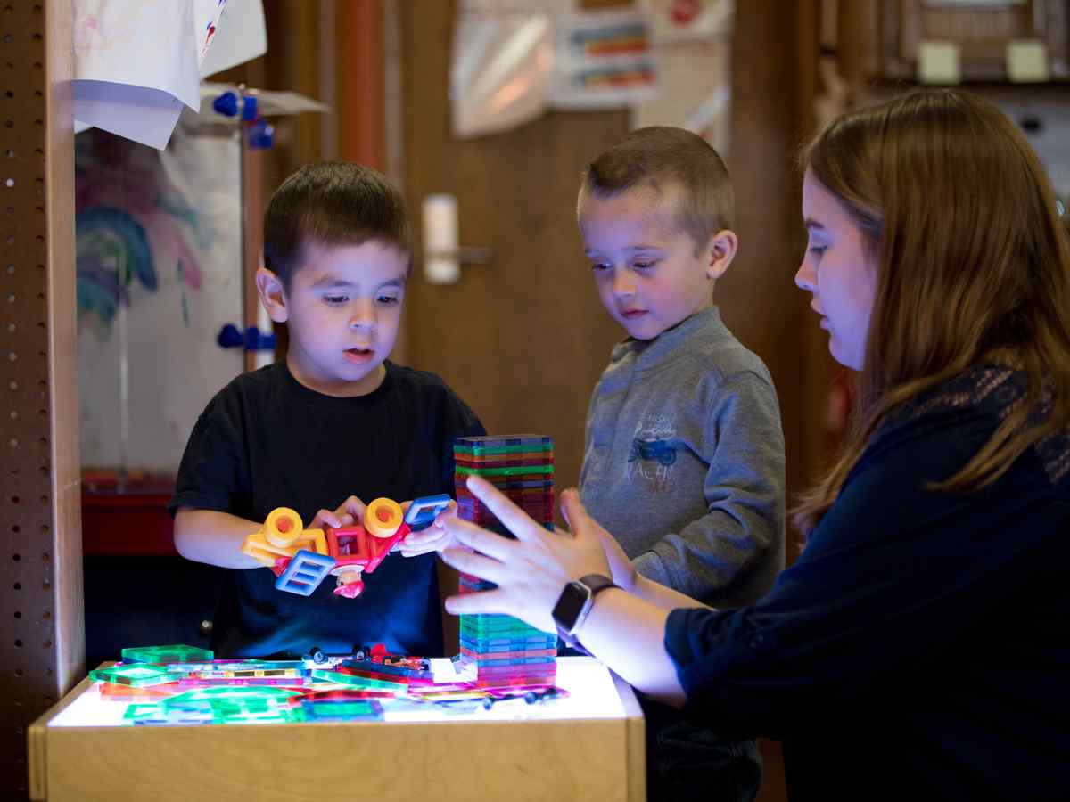 Female teacher working with children.