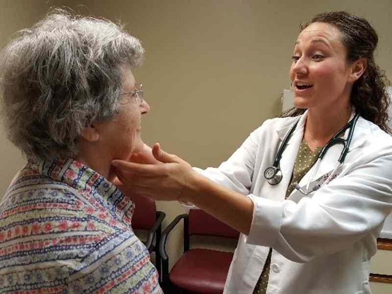 Student working with a patient