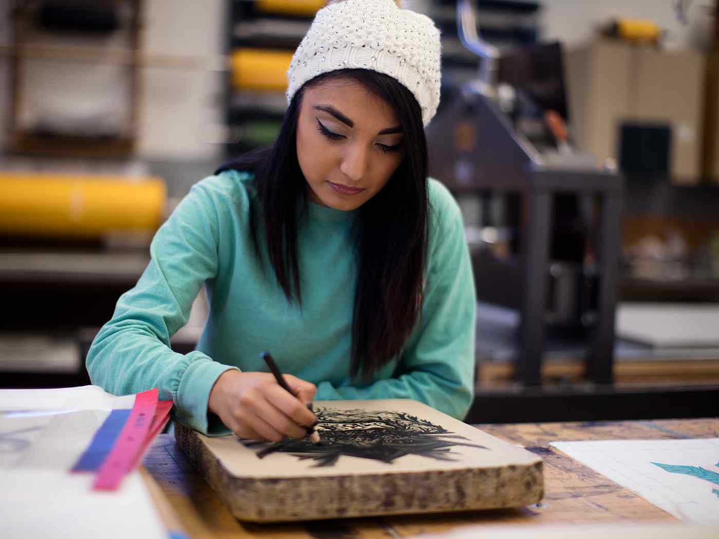 Applied Drawing student drawing on a slab or tablet.