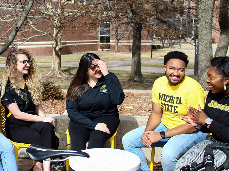Education students chatting outside on campus