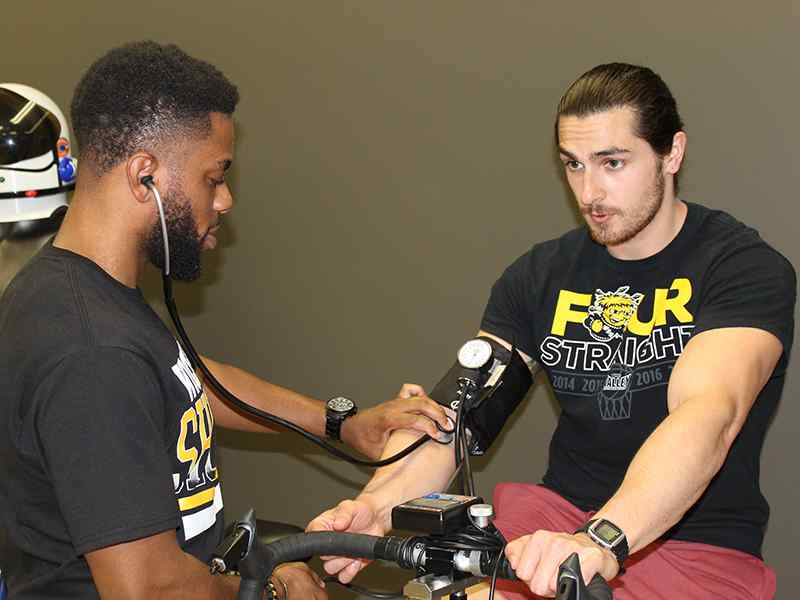 Exercise Science students performing a test in the Human Performance lab.