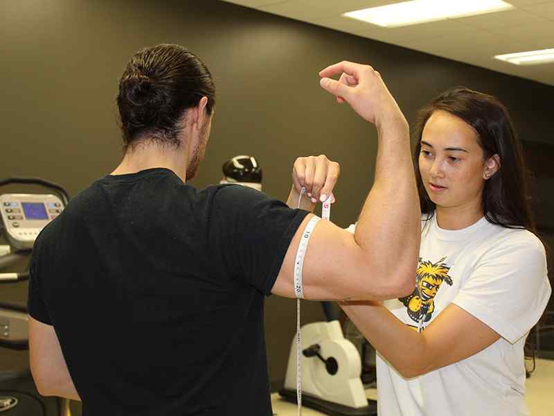Exercise Science students performing a test in the Human Performance lab.